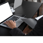An image portraying a person working with computers and documents, emphasizing the analytical approach taken by Sprobuj Digital Agency in social media services.